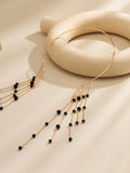 Collier pendentif frangé en fausse perle